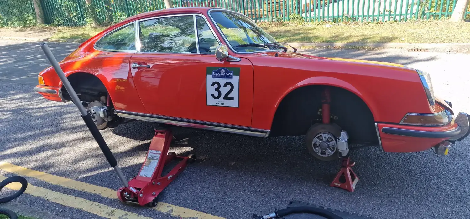 Classic car getting detailed. The side of it is propped up a little so the underside can be worked on