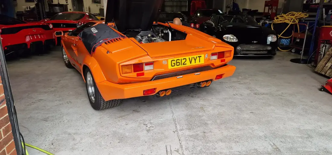 Back shot of a classic bright orange Lamborghini