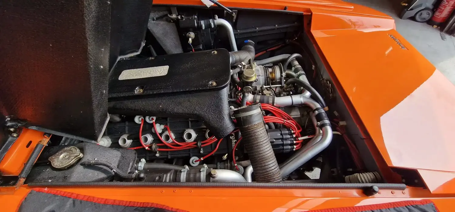 Inside shot of an open classic Lamborghini engine