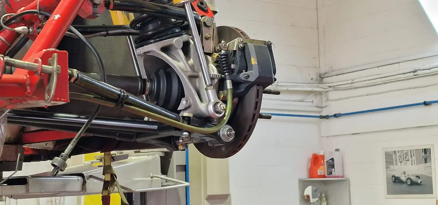 Back shot of a racing car with every part spotless due to dry ice blast cleaning